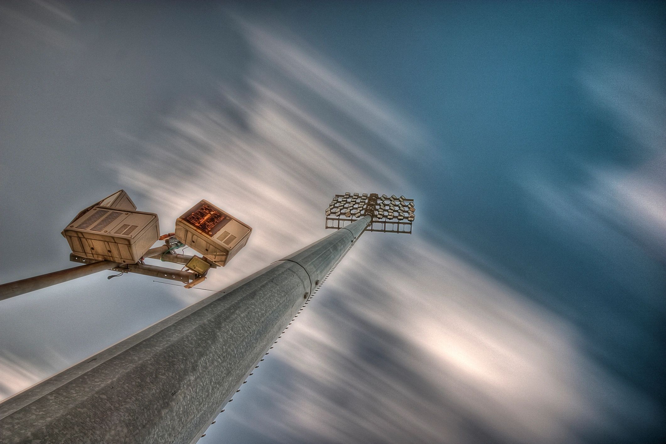 Stadium lighting and sound system on a pillar
